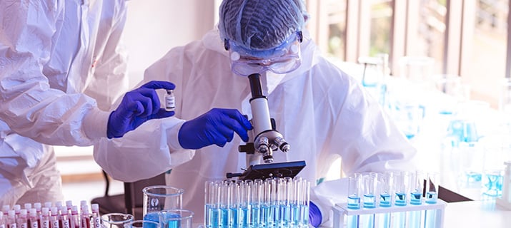 CLIA certified laboratory technician performing blood test analysis for accurate diagnostic results